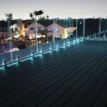 IG Railing Illuminated Glass Railing lit up teal at night